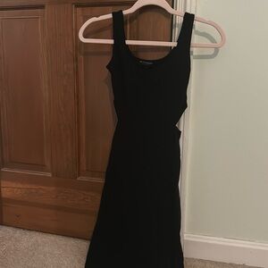 Size Small black dress with side cut outs. Only worn once